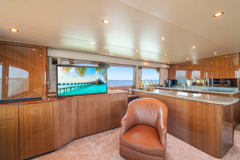 Slide: The Image of Luxurious interior of 2006 Viking 68 Convertible yacht with elegant wood finishes and modern amenities. - 22