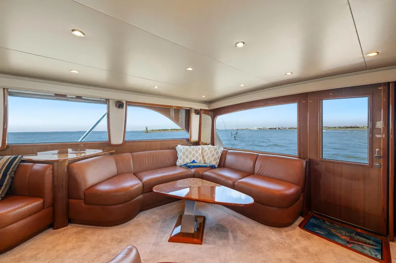 Slide: The Image of Luxurious interior of 2006 Viking 68 Convertible yacht with leather seating and ocean view. - 23