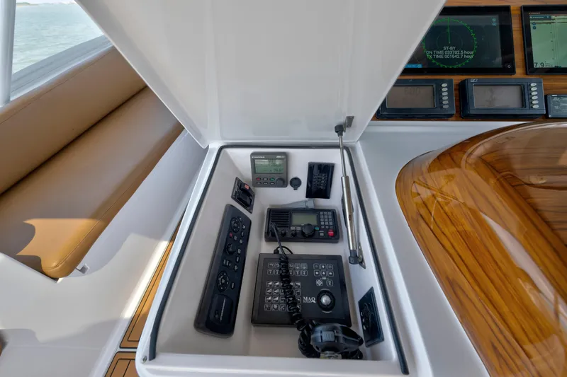 Slide: The Image of Control panel of a 2006 Viking 68 Convertible yacht with navigation equipment. - 10