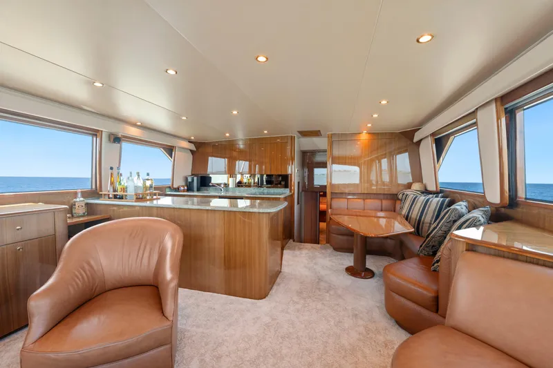 Slide: The Image of Luxurious interior of 2006 Viking 68 Convertible yacht with elegant seating and ocean views. - 21