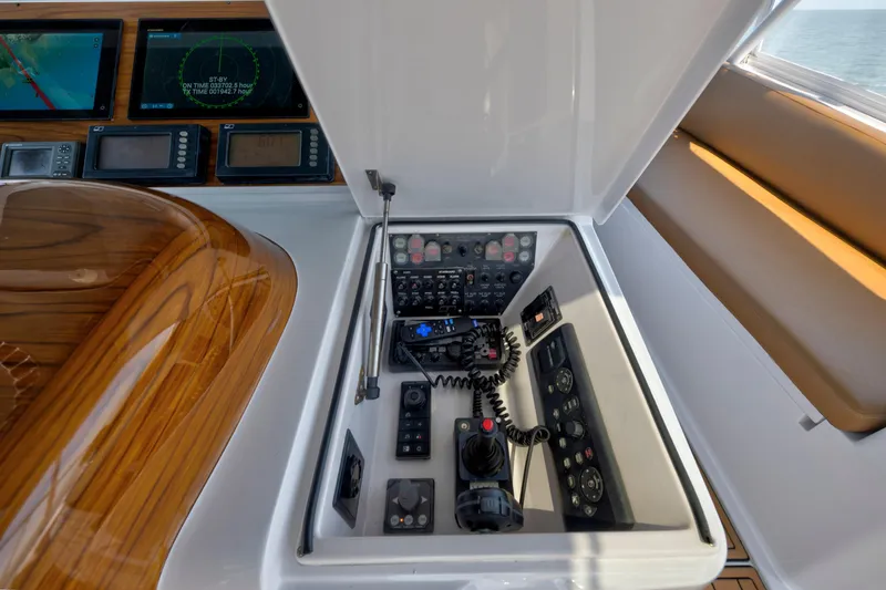 Slide: The Image of Control panel of a 2006 Viking 68 Convertible yacht with navigation screens. - 9