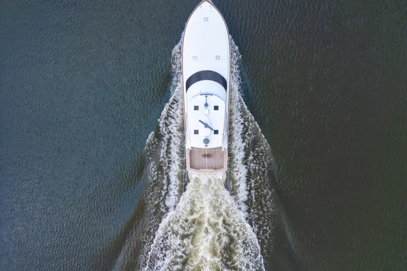 Slide: The Image of Aerial view of a 2006 Viking 68 Convertible yacht cruising on open water. - 4
