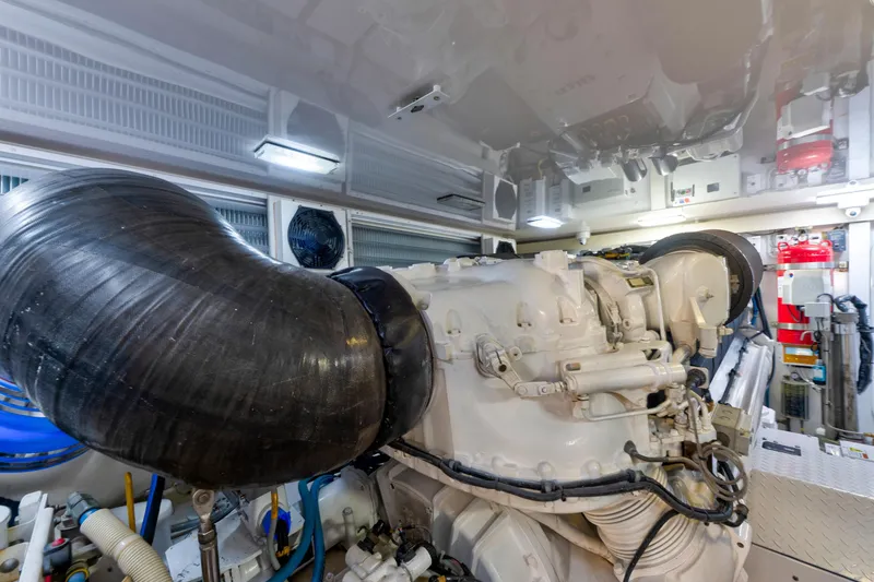 Slide: The Image of Engine room of a 2006 Viking 68 Convertible yacht, showcasing machinery and components. - 50