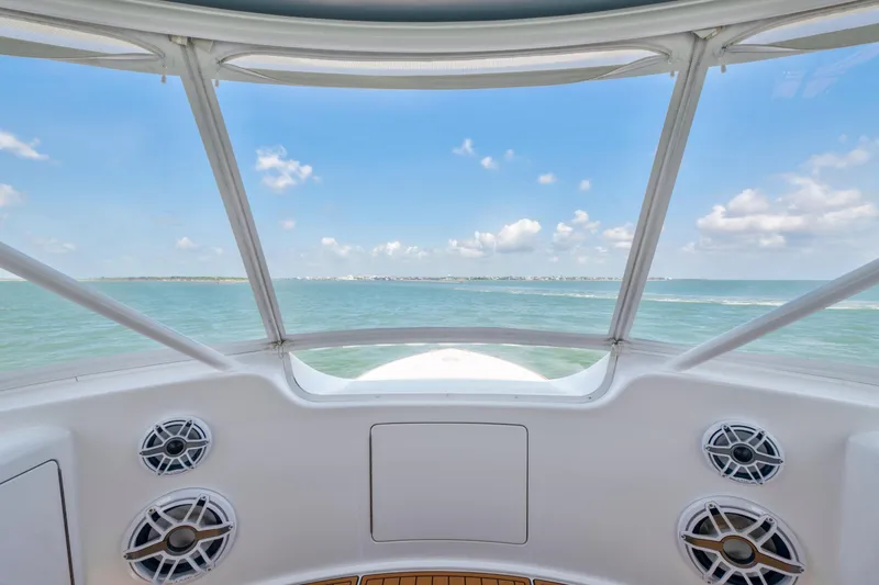 Slide: The Image of View from 2006 Viking 68 Convertible yacht cockpit, overlooking serene ocean and blue sky. - 13