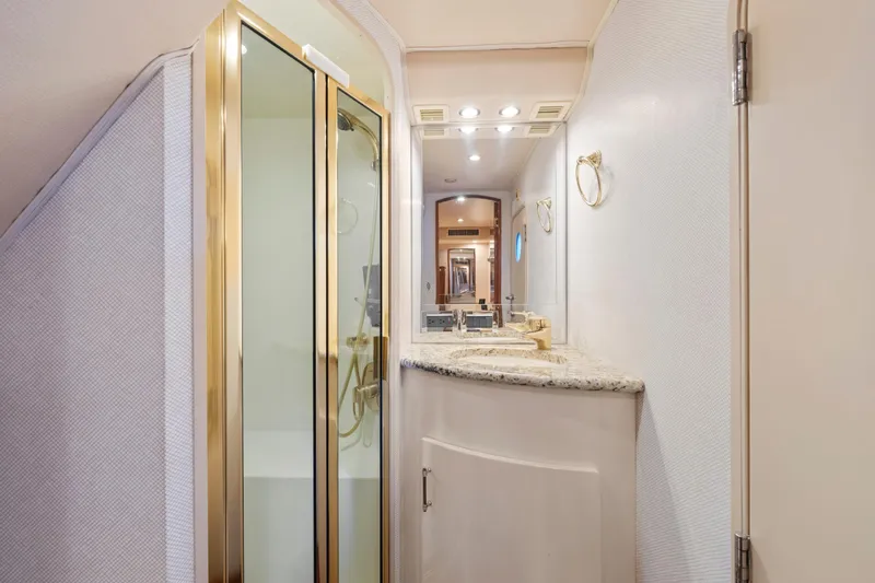 Slide: The Image of Luxurious bathroom in 2006 Viking 68 Convertible yacht with glass shower and granite countertop. - 38