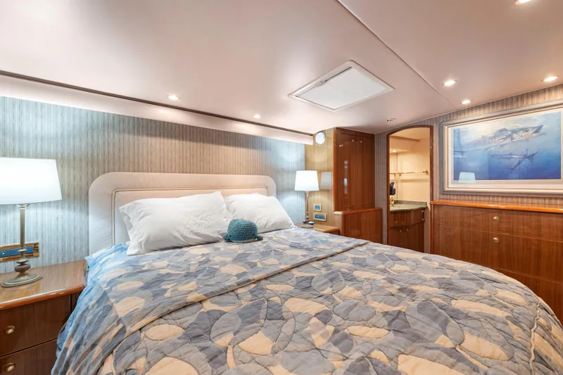 Slide: The Image of Luxurious bedroom interior of 2006 Viking 68 Convertible yacht with elegant decor and soft lighting. - 32