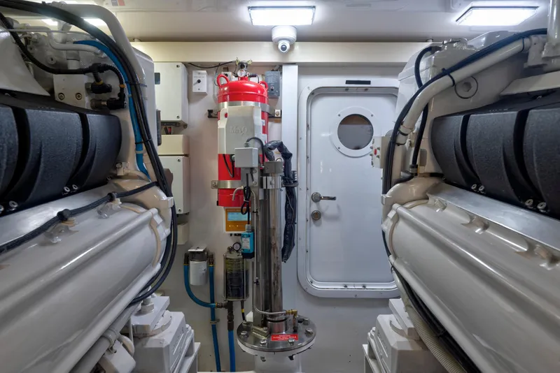 Slide: The Image of Engine room of a 2006 Viking 68 Convertible yacht, featuring machinery and equipment. - 47