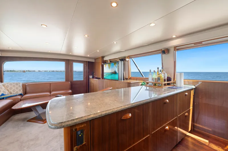 Slide: The Image of Luxurious interior of 2006 Viking 68 Convertible yacht with ocean view and elegant furnishings. - 30