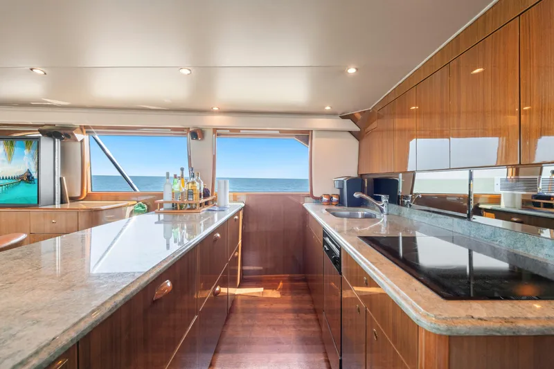 Slide: The Image of Luxurious kitchen interior of 2006 Viking 68 Convertible yacht with ocean view. - 28