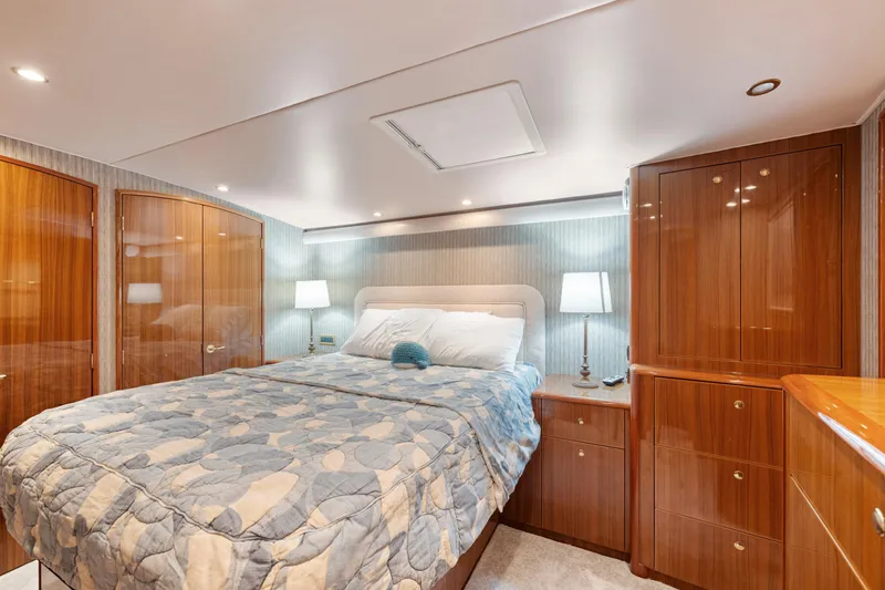 Slide: The Image of Luxurious bedroom interior of 2006 Viking 68 Convertible yacht with elegant wood finishes. - 31