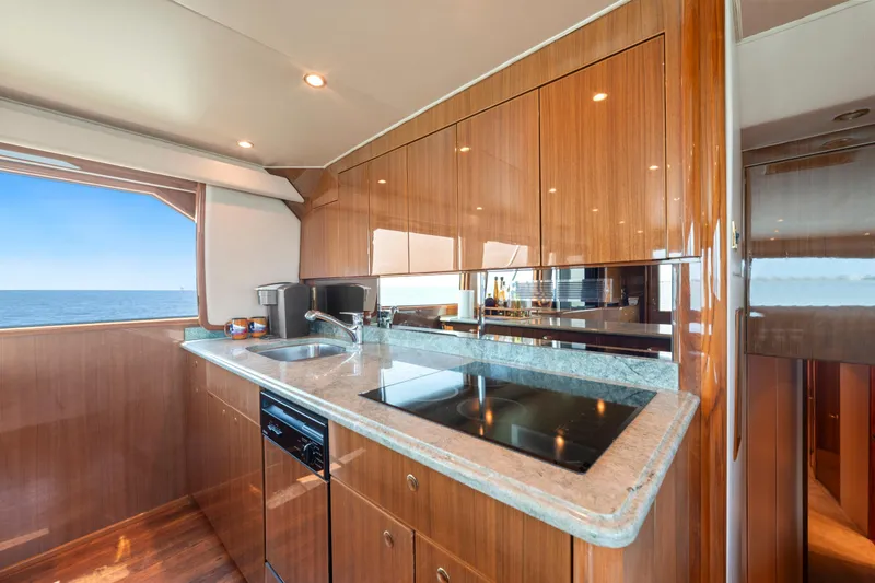 Slide: The Image of Luxurious kitchen interior of 2006 Viking 68 Convertible yacht with ocean view. - 29