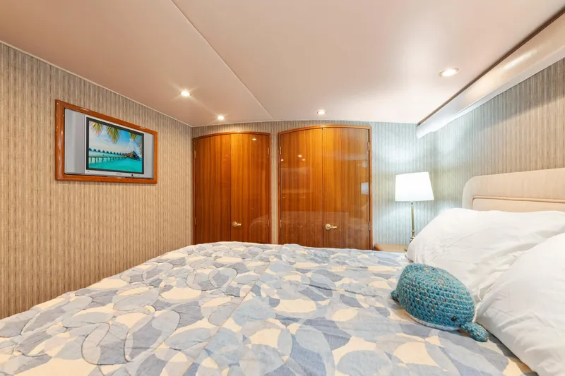 Slide: The Image of Luxurious bedroom interior of 2006 Viking 68 Convertible yacht with elegant decor. - 33