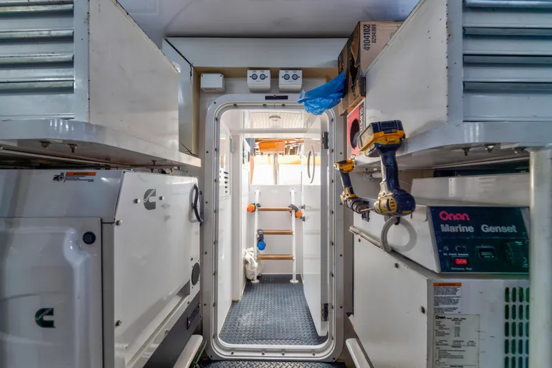 Slide: The Image of Engine room of 2006 Viking 68 Convertible yacht with tools and equipment. - 48