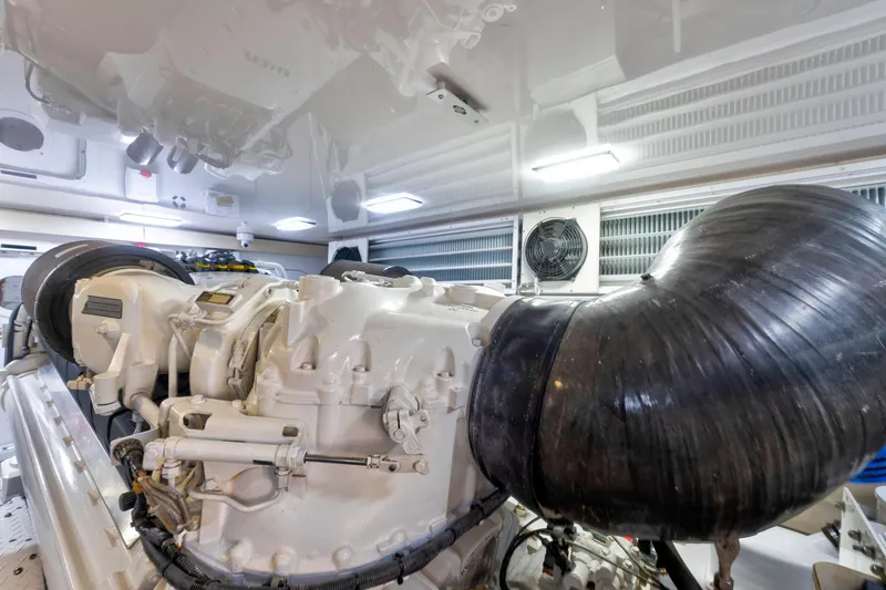 Slide: The Image of Engine room of a 2006 Viking 68 Convertible yacht, showcasing detailed machinery. - 49