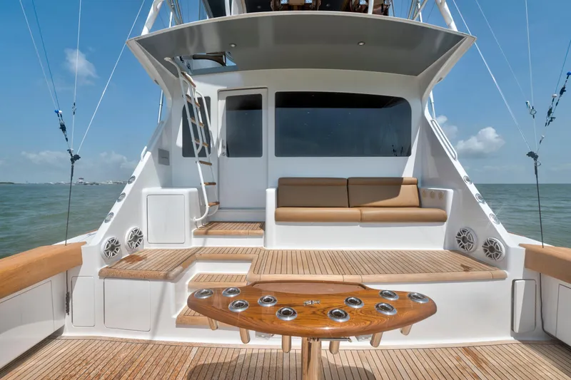 Slide: The Image of 2006 Viking 68 Convertible yacht deck with seating and ocean view. - 15