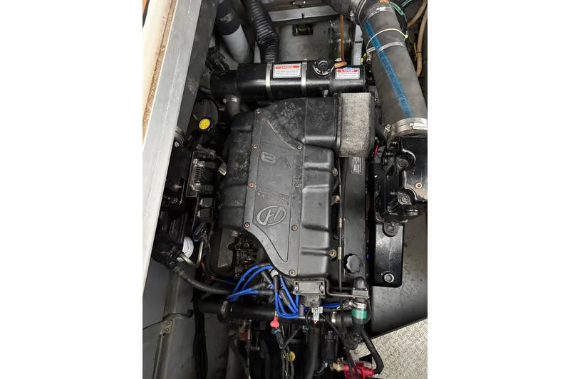 Slide: The Image of Engine of a 1999 Sea Ray 380 Sundancer boat, showcasing detailed components. - 25
