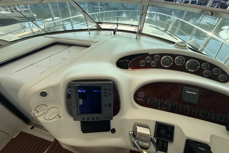 Slide: The Image of Cockpit of 1999 Sea Ray 380 Sundancer with navigation equipment and controls. - 8