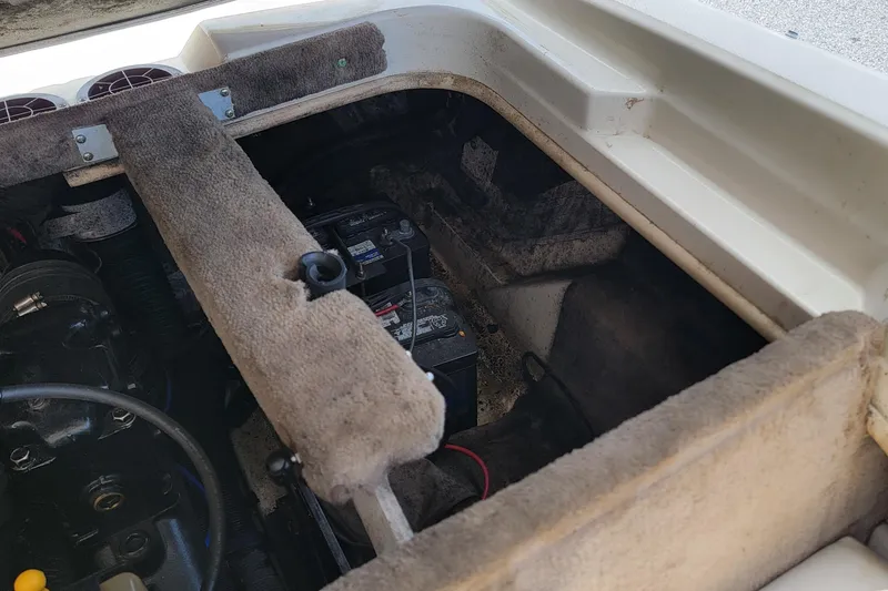 Slide: The Image of 2003 Sea Ray 182 Bow Rider engine compartment with visible battery and components. - 6