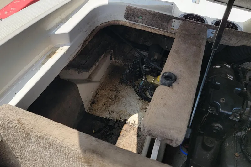 Slide: The Image of Engine compartment of a 2003 Sea Ray 182 Bow Rider boat, showing interior details. - 7
