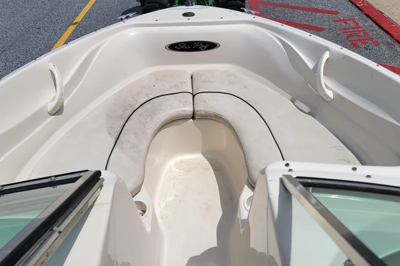 Slide: The Image of 2003 Sea Ray 182 Bow Rider boat interior with seating and open bow area. - 11