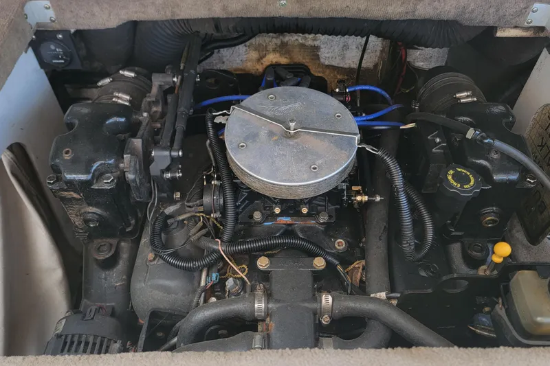 Slide: The Image of Engine compartment of a 2003 Sea Ray 182 Bow Rider boat, showcasing mechanical components. - 5