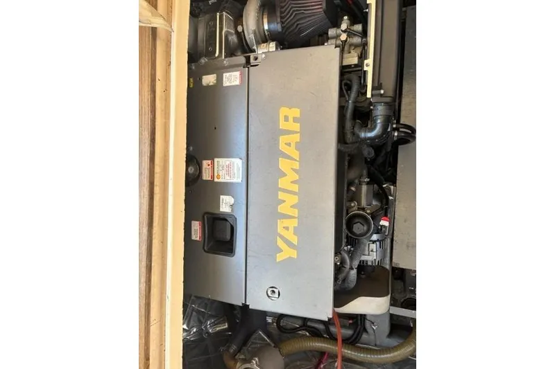 Slide: The Image of Yanmar engine in a 2001 Apreamare 9 M boat, showcasing mechanical components. - 27