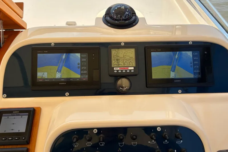 Slide: The Image of Dashboard of a 2001 Apreamare 9 M boat with navigation displays and controls. - 13