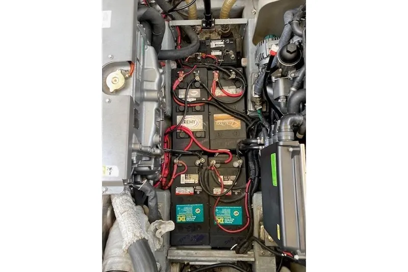 Slide: The Image of Engine compartment of a 2001 Apreamare 9 M boat, showing batteries and wiring. - 28