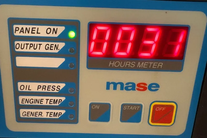 Slide: The Image of Apreamare 9 M 2001 generator control panel with hours meter display. - 25