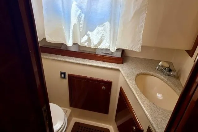 Slide: The Image of Bathroom interior of a 2001 Apreamare 9 M yacht, featuring a sink and toilet. - 18