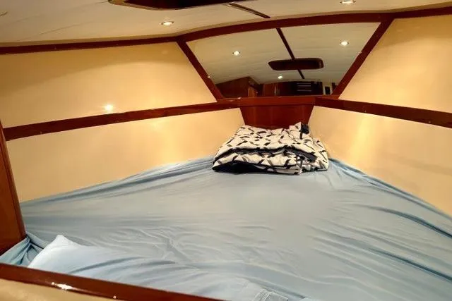 Slide: The Image of Interior cabin of 2001 Apreamare 9 M boat with cozy bedding. - 15