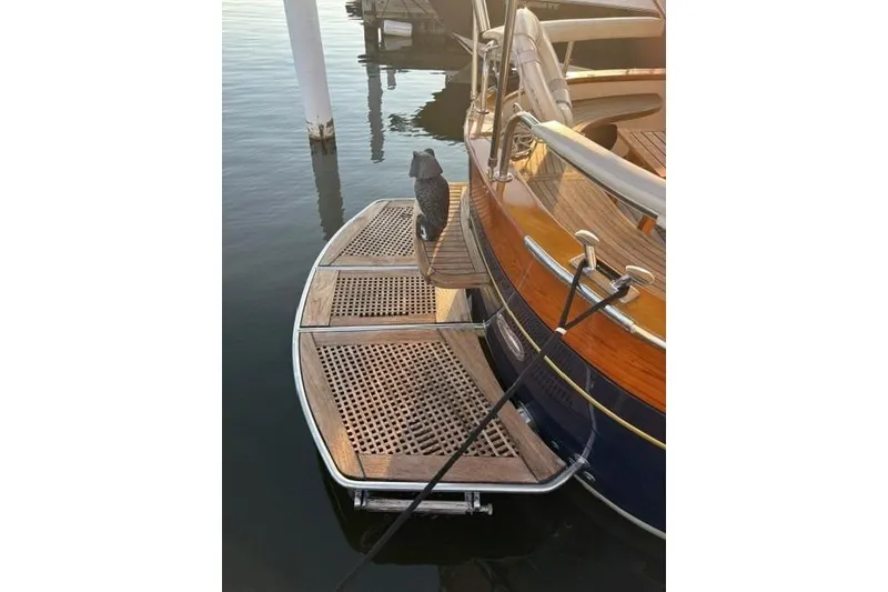 Slide: The Image of 2001 Apreamare 9 M yacht with wooden deck and mooring ropes at a marina. - 29