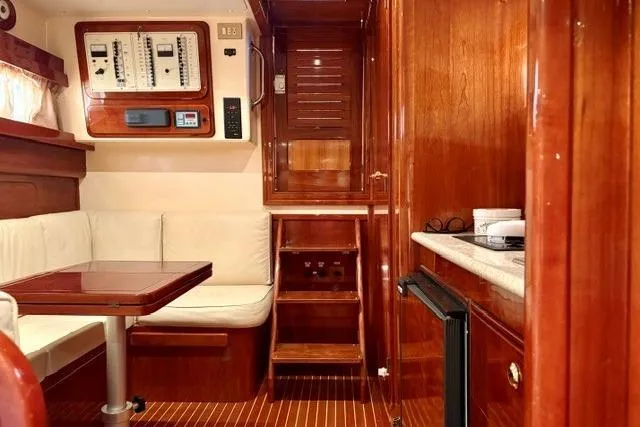 Slide: The Image of Luxurious interior of 2001 Apreamare 9 M yacht with wood finish and seating area. - 16