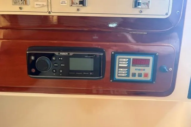Slide: The Image of Control panel of a 2001 Apreamare 9 M boat with audio and generator displays. - 20