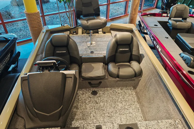 Slide: The Image of 2026 Tracker Pro Team 175 boat interior with seating and steering console. - 8