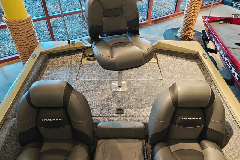 Slide: The Image of 2026 Tracker Pro Team 175 boat interior with cushioned seating and carpeted deck. - 9