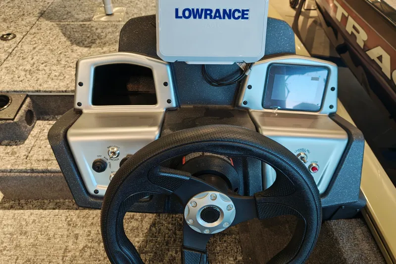 Slide: The Image of Steering console of 2026 Tracker Pro Team 175 boat with Lowrance electronics. - 14