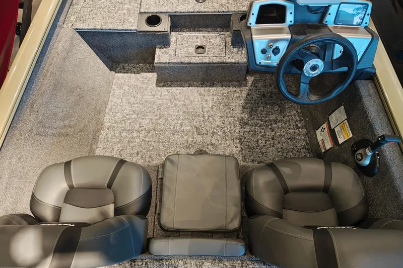Slide: The Image of Interior of 2026 Tracker Pro Team 175 boat with steering wheel and seating. - 12