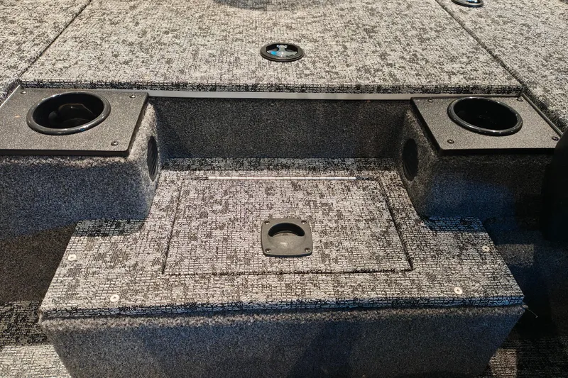 Slide: The Image of Interior of 2026 Tracker Pro Team 175 boat with carpeted storage compartments. - 18