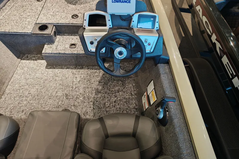 Slide: The Image of 2026 Tracker Pro Team 175 boat interior with steering wheel and control panel. - 13
