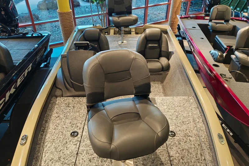 Slide: The Image of 2026 Tracker Pro Team 175 boat interior with cushioned seating and carpeted flooring. - 7
