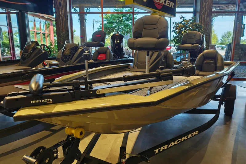 Slide: The Image of 2026 Tracker Pro Team 175 boat with Minn Kota Edge motor displayed indoors. - 3