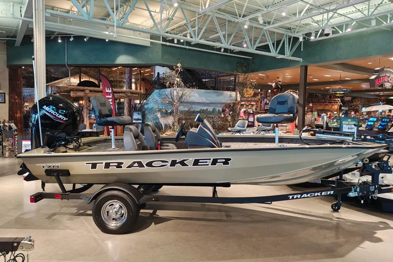 The Image of 2026 Tracker Pro Team 175 boat displayed indoors with Mercury engine. - 1
