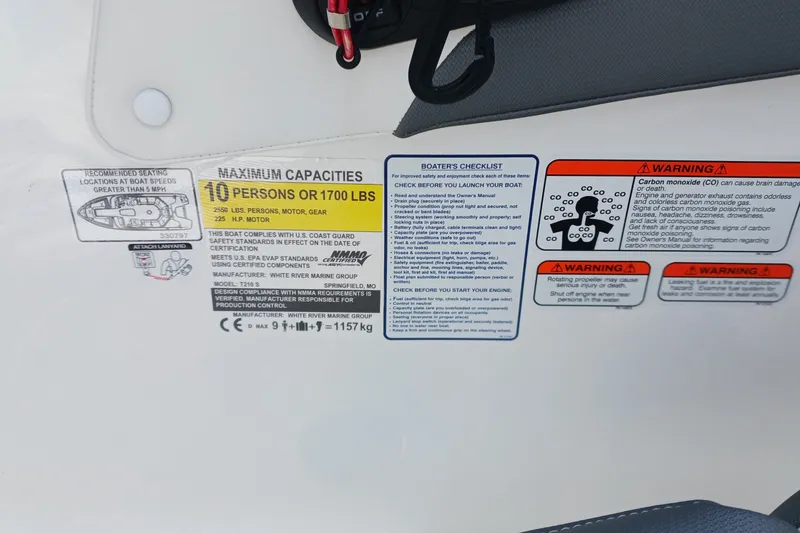 Slide: The Image of 2024 Tahoe 210 S capacity label detailing maximum load and safety warnings. - 11