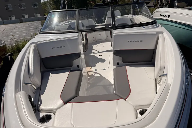 Slide: The Image of 2024 Tahoe 210 S boat interior with white seating and windshield. - 8