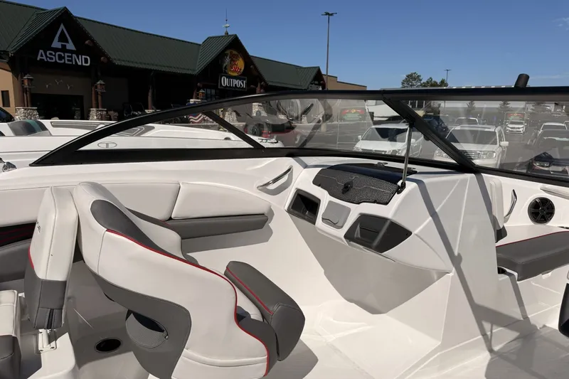 Slide: The Image of 2024 Tahoe 210 S boat interior with modern seating and dashboard design. - 7