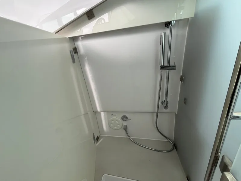 Slide: The Image of The shower in the 2024 Axopar 37 XC Cross Cabin is modern and functional. - 19