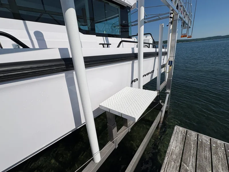 Slide: The Image of Side view of the 2024 Axopar 37 XC Cross Cabin at the dock. - 27