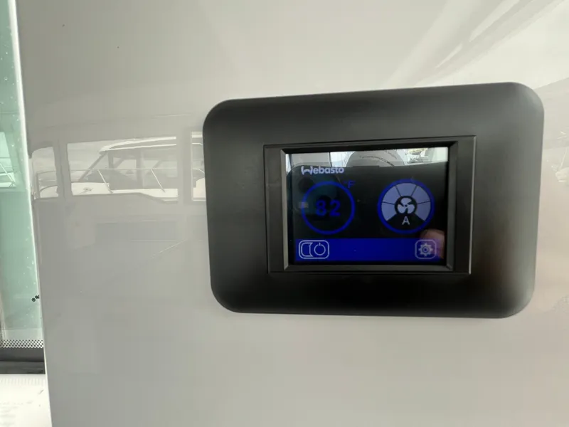 Slide: The Image of A digital control display in a 2024 Axopar 37 XC Cross Cabin. - 14