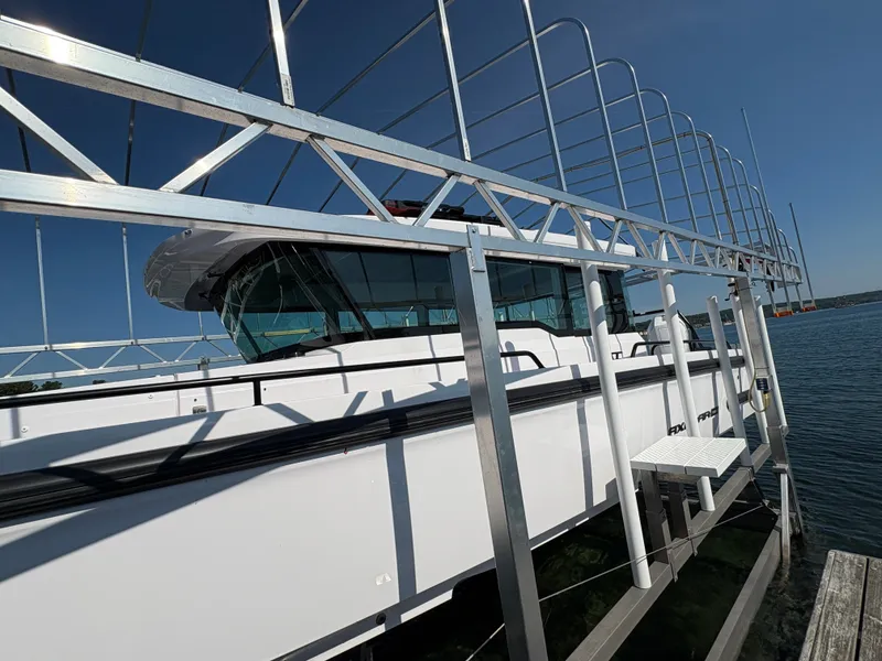 Slide: The Image of An Axopar 37 XC Cross Cabin boat from 2024 is docked. - 25